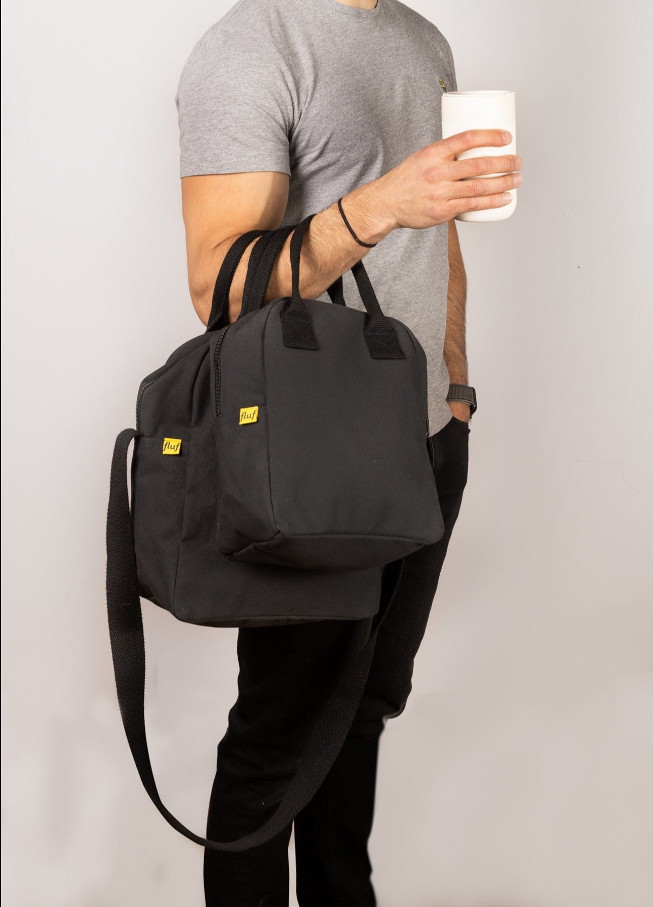 A male model hold modern picnic lunch bag and zipper lunch bag