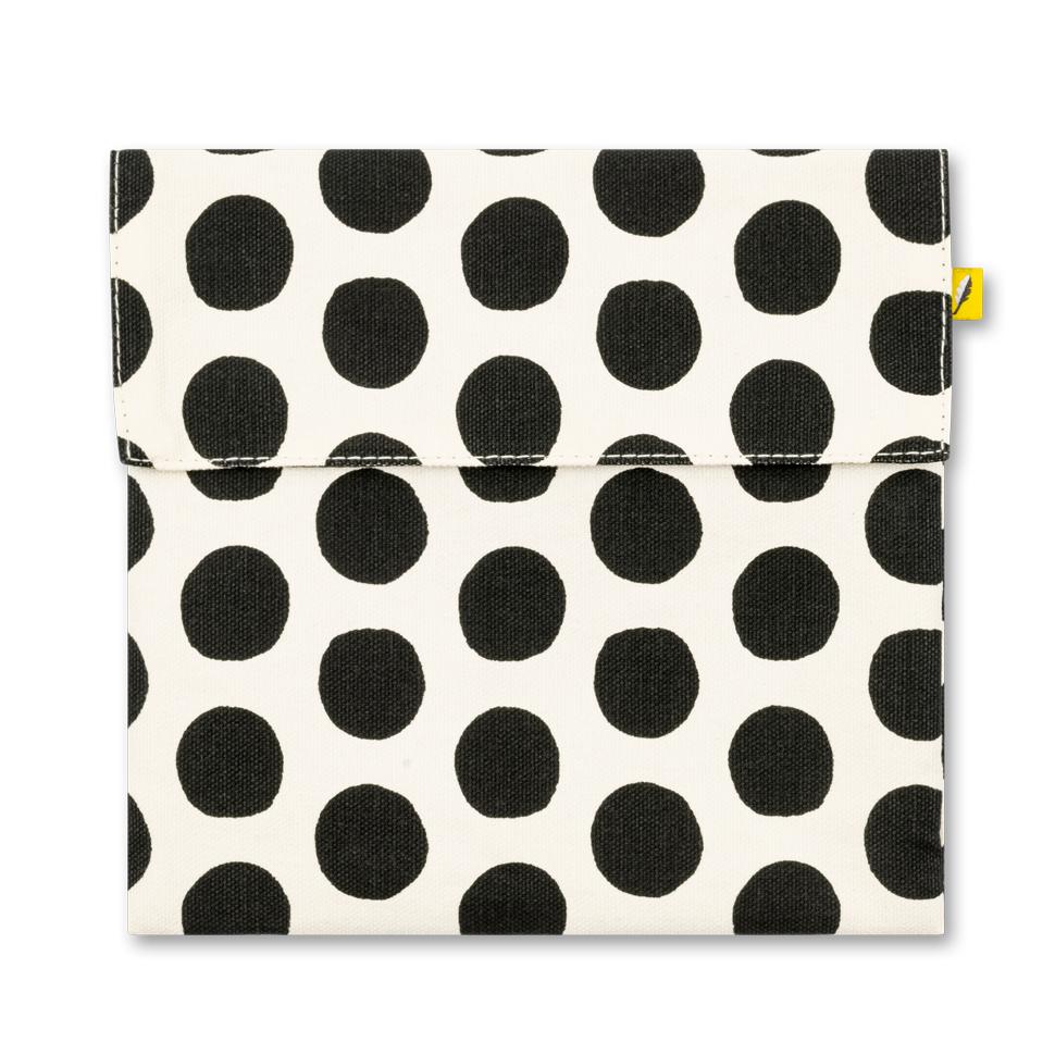 Reusable and machine washable snack bag in a sandwich size, with black and white dots design