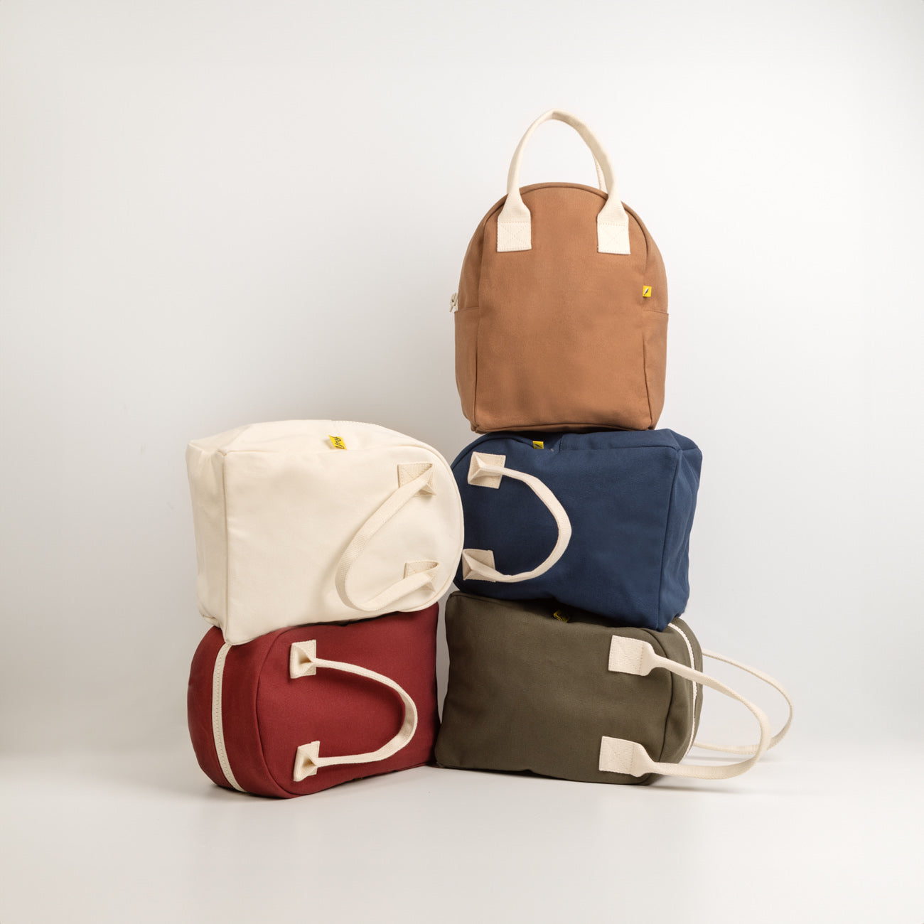 5 different colors of Flat Zipper Lunch bags  by fluf canada